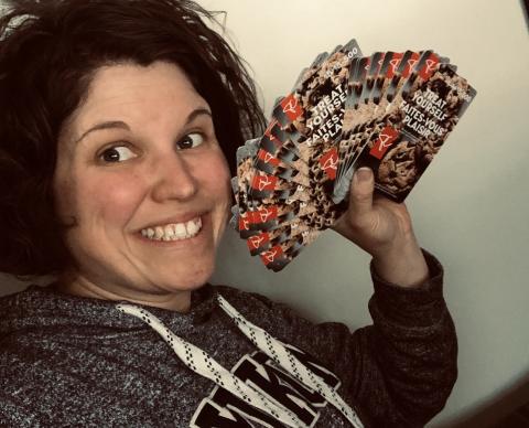 woman holds gift cards